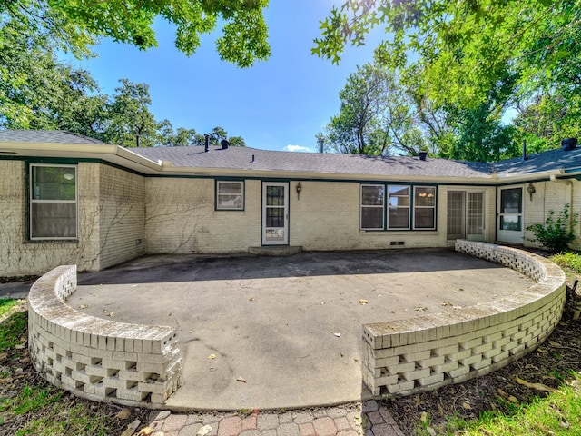 rear view of property featuring a patio area