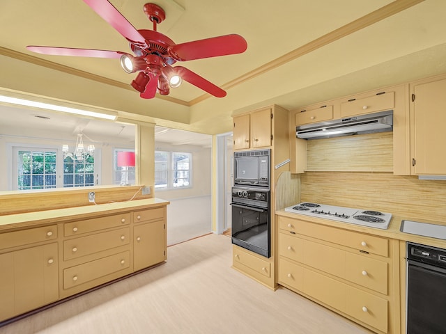 kitchen with a healthy amount of sunlight, black appliances, backsplash, and ceiling fan with notable chandelier