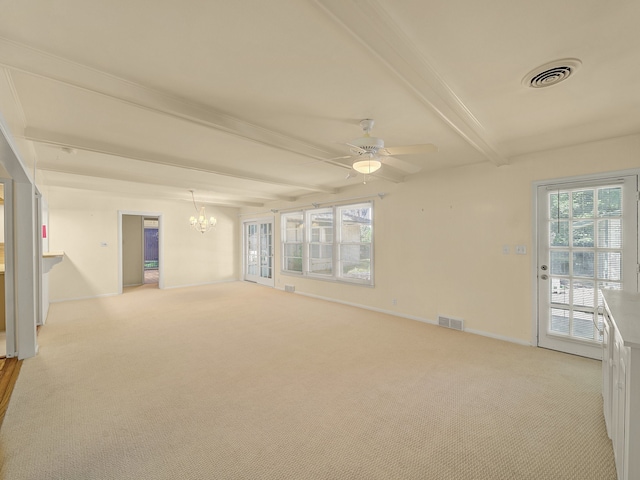 carpeted empty room featuring ceiling fan with notable chandelier and beamed ceiling