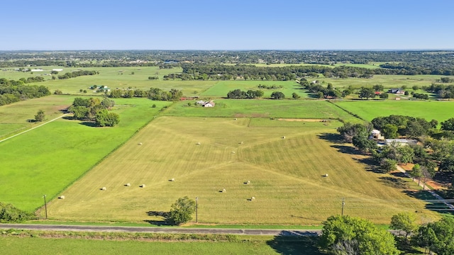 birds eye view of property featuring a rural view