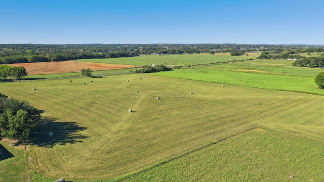 birds eye view of property featuring a rural view