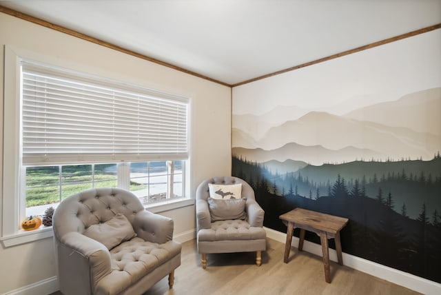 living area featuring light hardwood / wood-style flooring and crown molding