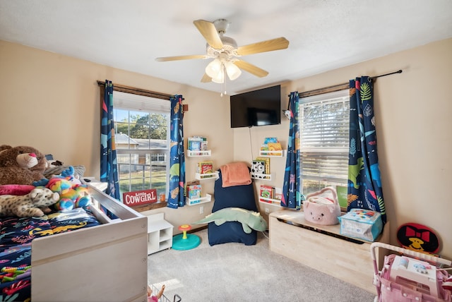 playroom featuring ceiling fan and carpet flooring