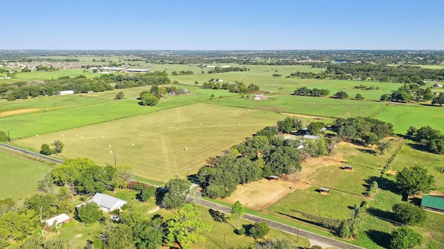 birds eye view of property featuring a rural view