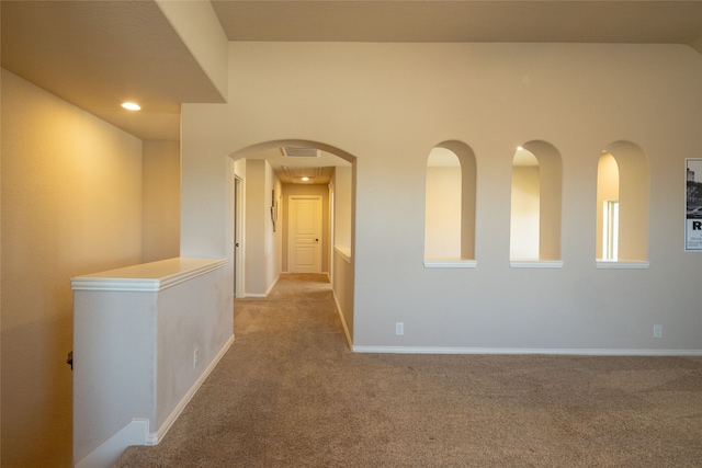 hallway with light carpet