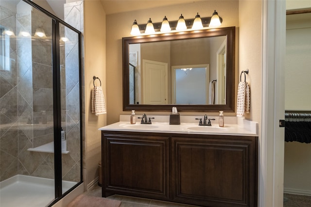 bathroom featuring walk in shower and vanity