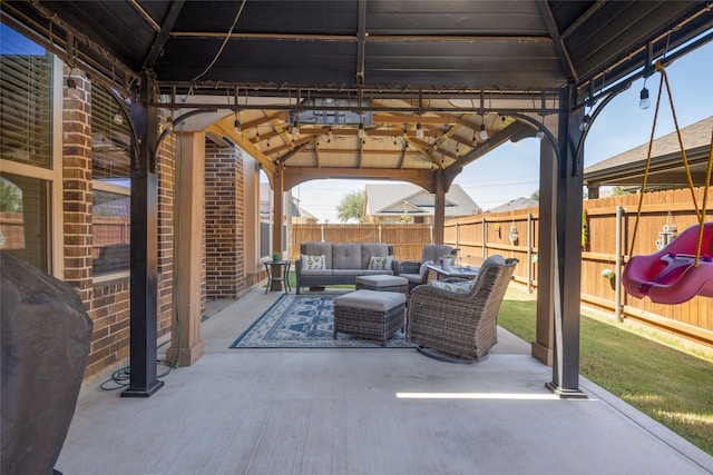 view of patio / terrace with a gazebo, grilling area, and an outdoor hangout area