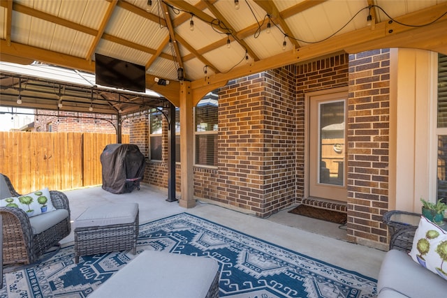 view of patio / terrace featuring a gazebo, area for grilling, and an outdoor living space