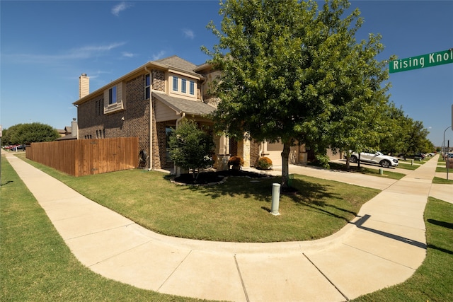 view of front of house featuring a front lawn