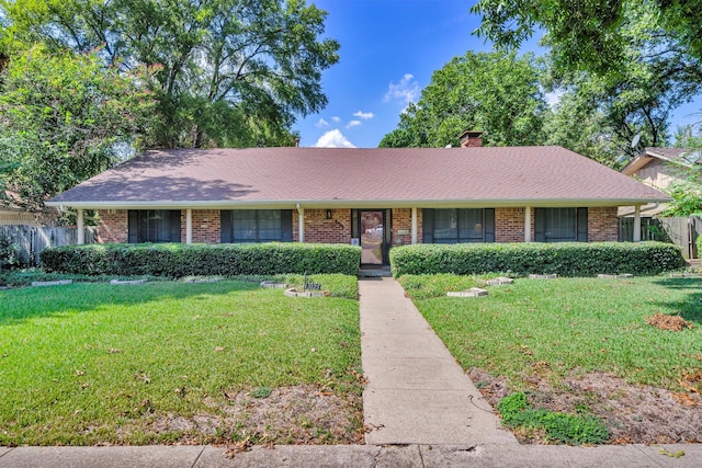 ranch-style home featuring a front yard