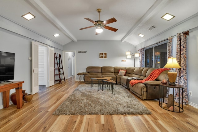 living room with lofted ceiling with beams, ceiling fan, and light hardwood / wood-style flooring