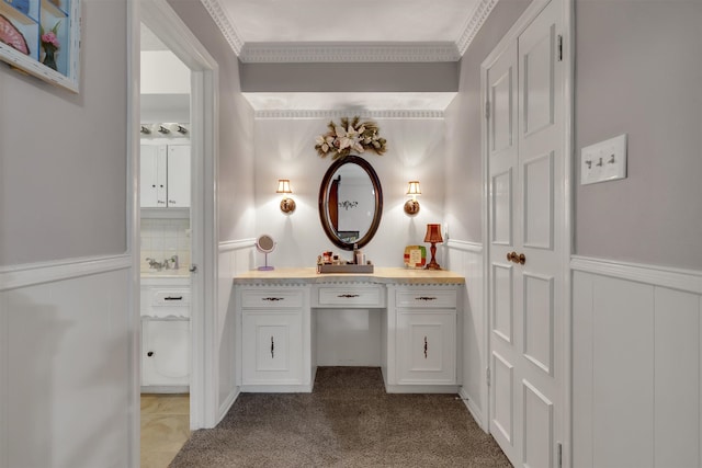 bathroom featuring ornamental molding, decorative backsplash, and vanity