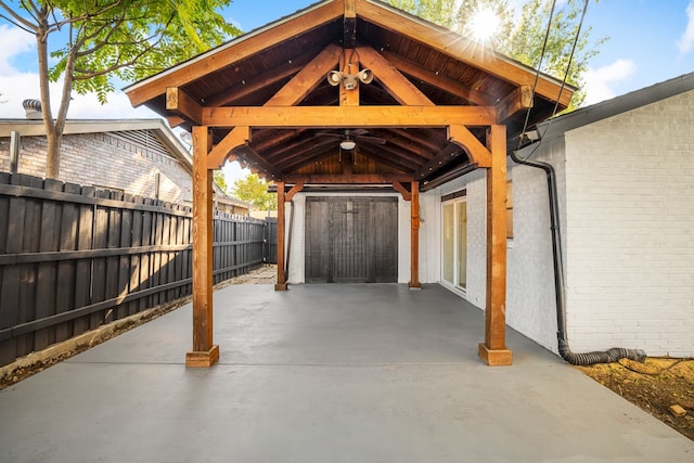 view of parking / parking lot with ceiling fan and a gazebo