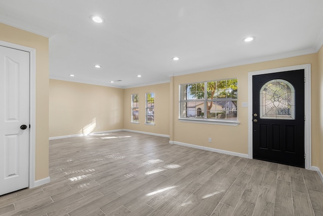 foyer featuring light hardwood / wood-style flooring and ornamental molding