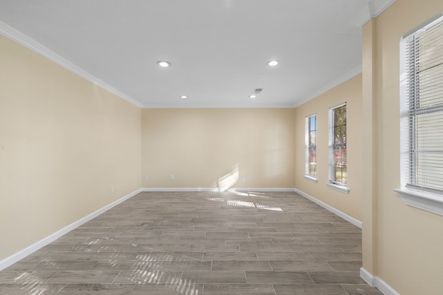 spare room with wood-type flooring and crown molding