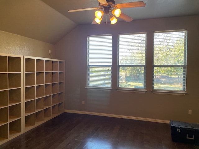 additional living space featuring ceiling fan, dark hardwood / wood-style flooring, a healthy amount of sunlight, and lofted ceiling