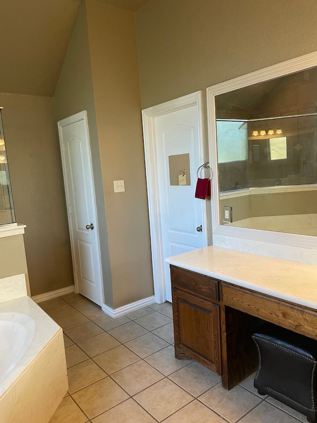 bathroom with tile patterned floors, vanity, and shower with separate bathtub