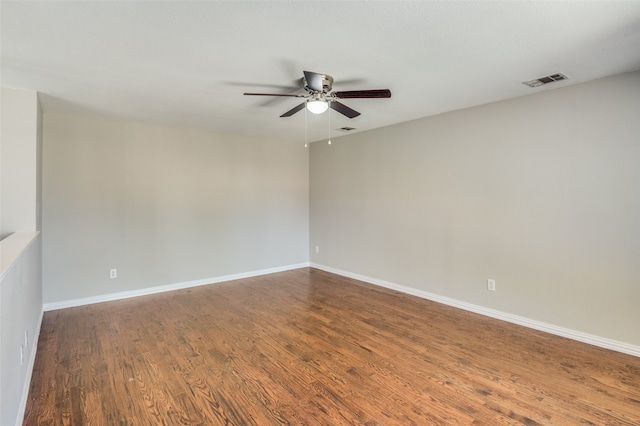 spare room featuring wood-type flooring and ceiling fan