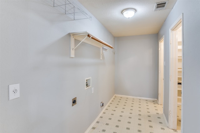 laundry room with washer hookup, a textured ceiling, and electric dryer hookup