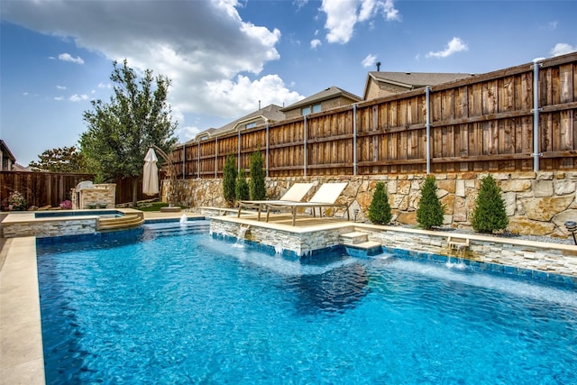 view of swimming pool featuring an in ground hot tub and pool water feature