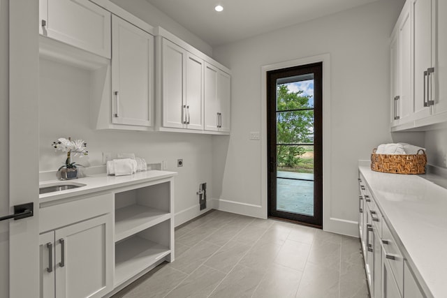 washroom featuring cabinets and electric dryer hookup