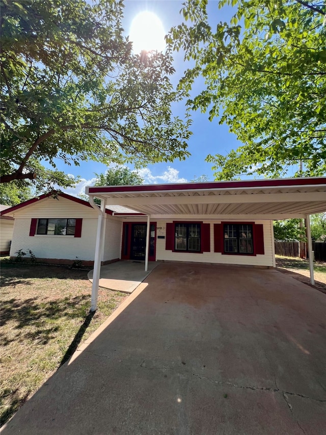 ranch-style home with a carport