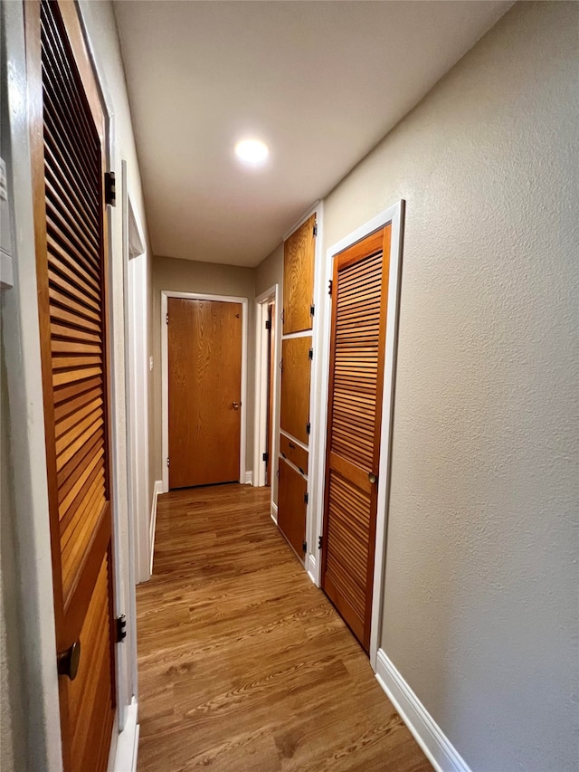 hall with light wood-type flooring