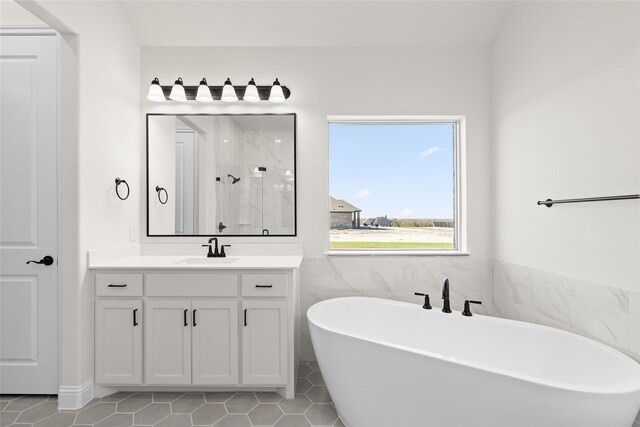 170 Waterview Dr, Gunter, TX 75058 - bathroom featuring a marble finish shower, tile patterned floors, vanity, and a freestanding tub