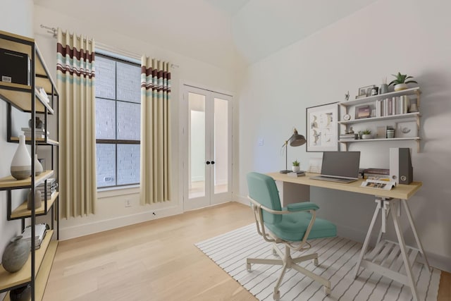 office space with light hardwood / wood-style flooring and french doors