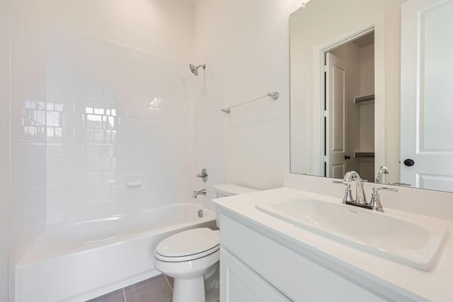 full bathroom featuring tile patterned flooring, vanity, tiled shower / bath combo, and toilet