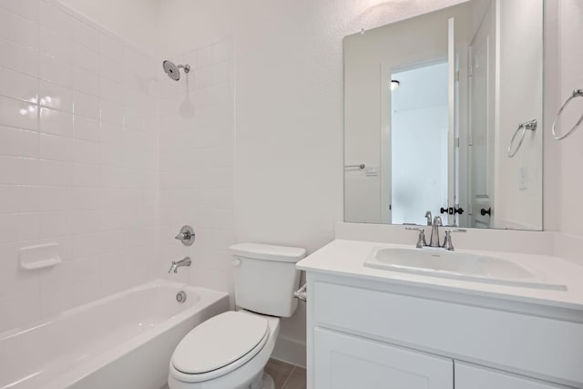 full bathroom featuring vanity, toilet, and tiled shower / bath