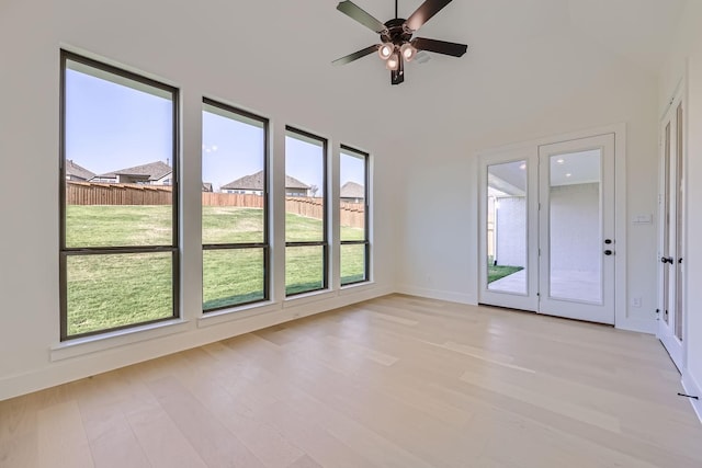 unfurnished room with ceiling fan and light hardwood / wood-style flooring