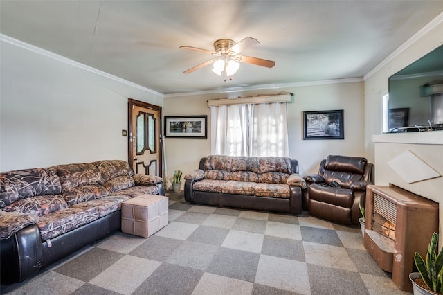 carpeted living room featuring crown molding and ceiling fan