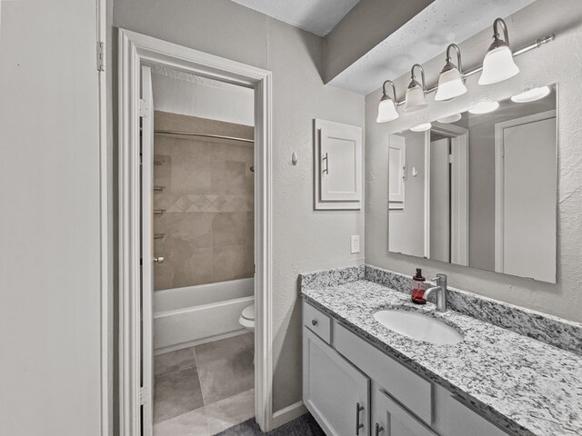 bathroom featuring toilet, a textured ceiling, and shower / bath combo with shower curtain