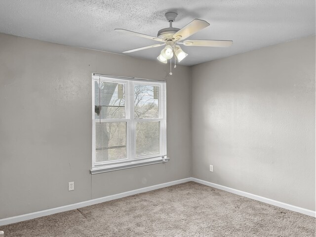 washroom with a textured ceiling and washer and clothes dryer