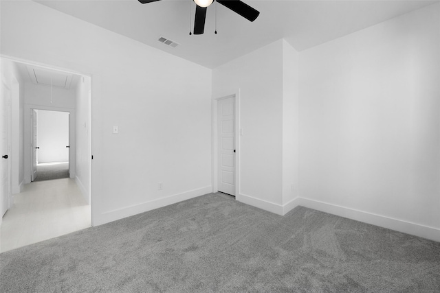 309 W Beckham St W, Sulphur Springs, TX 75482 - spare room featuring attic access, a ceiling fan, carpet floors, and baseboards