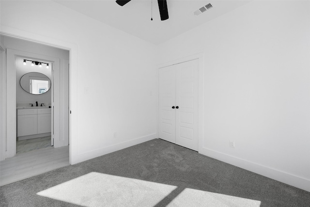 309 W Beckham St W, Sulphur Springs, TX 75482 - unfurnished bedroom featuring carpet, a sink, and baseboards