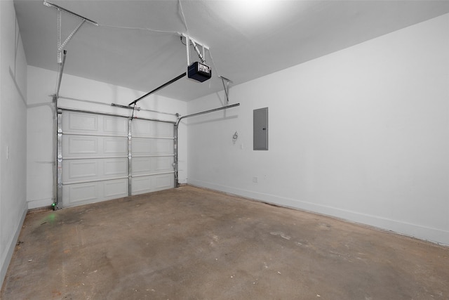 309 W Beckham St W, Sulphur Springs, TX 75482 - garage with electric panel, a garage door opener, and baseboards