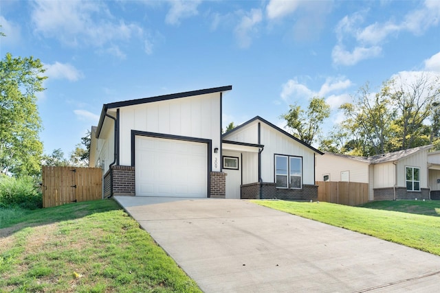 309 W Beckham St W, Sulphur Springs, TX 75482 - view of front facade featuring brick siding, an attached garage, and concrete driveway