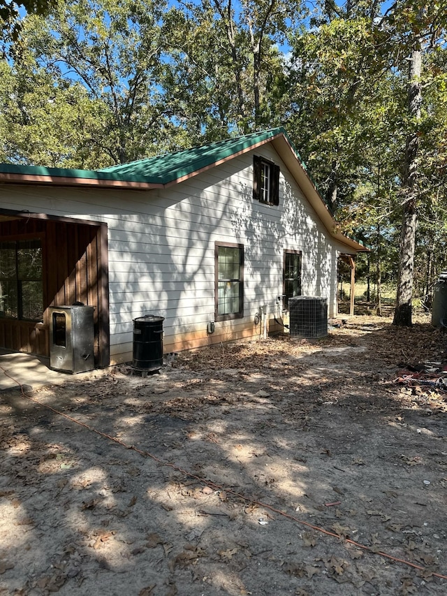 view of side of property with cooling unit