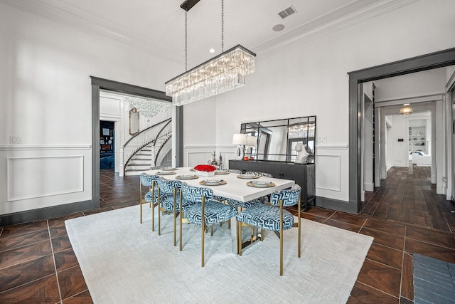 dining room with dark parquet floors and crown molding