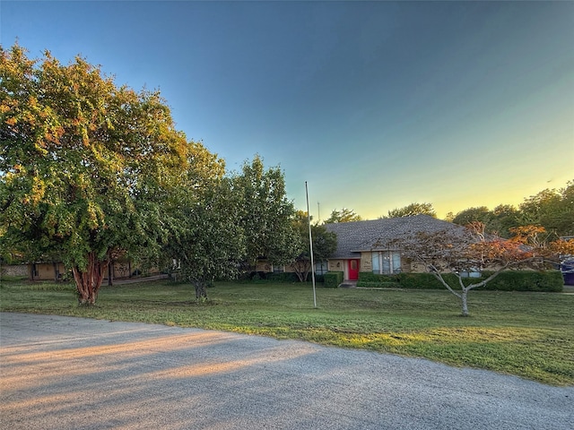 view of front of house with a yard