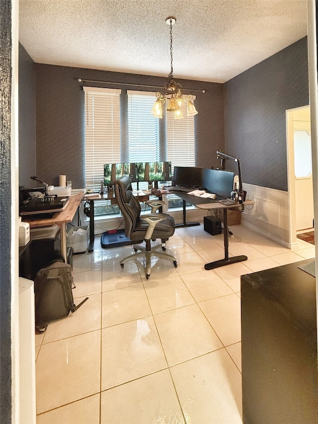 office area featuring a chandelier, a textured ceiling, and tile patterned floors