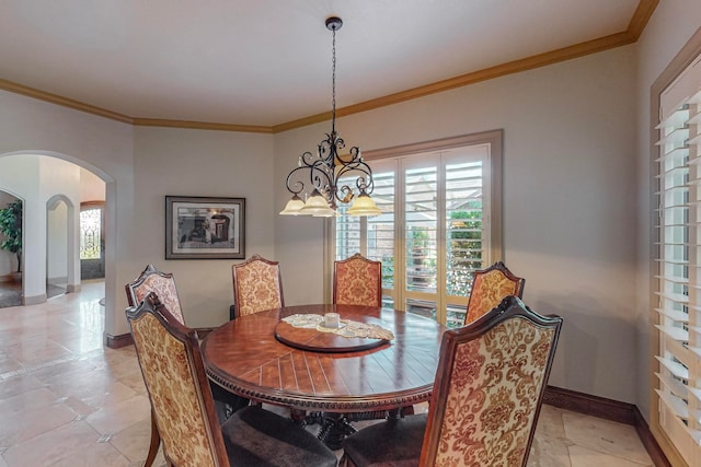 dining area with a notable chandelier, plenty of natural light, and ornamental molding