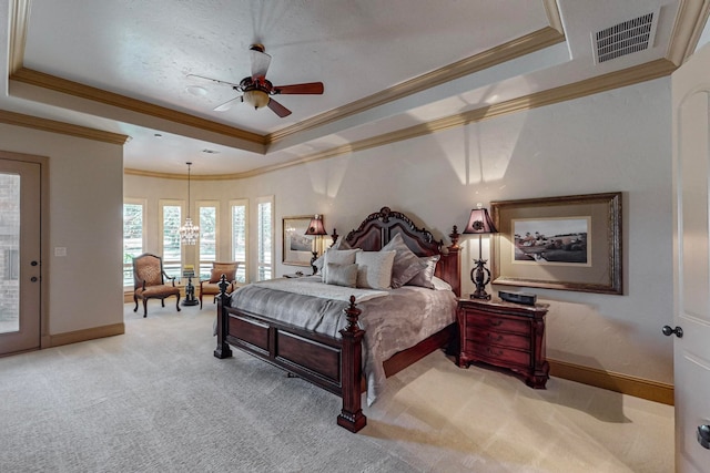 carpeted bedroom with ceiling fan with notable chandelier, a raised ceiling, and access to outside