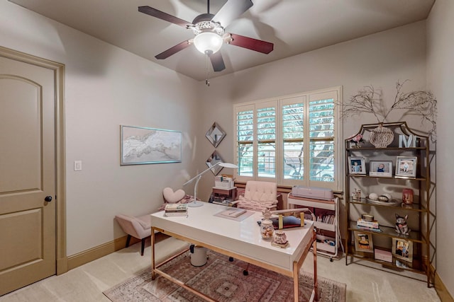 carpeted office with ceiling fan