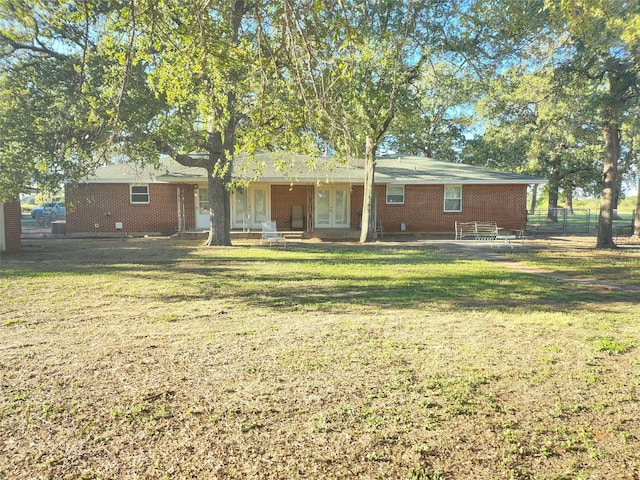 rear view of house with a lawn