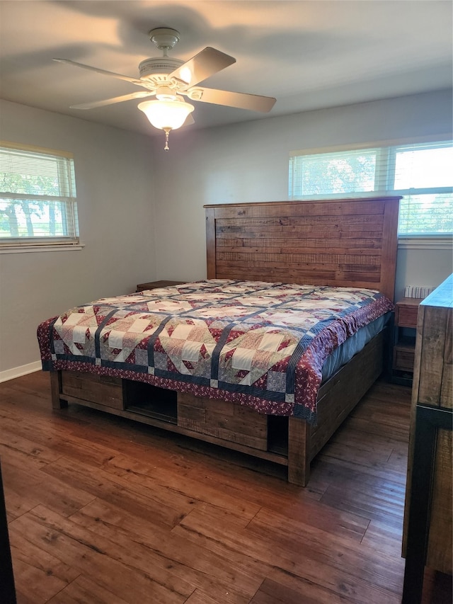 bedroom featuring dark wood-type flooring and ceiling fan