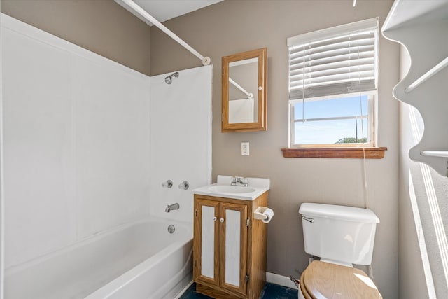 full bathroom featuring vanity, bathing tub / shower combination, and toilet