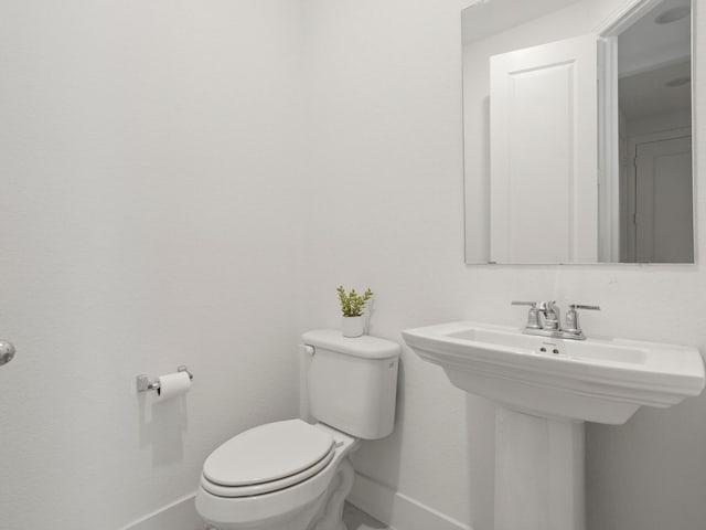 bathroom with sink and toilet